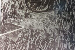 Particolare di fotografia aerea storica della collezione RAF con segni evidenti di bombardamento, Aerofototeca Nazionale